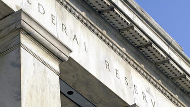 A detail of a photo of the Federal Reserve building