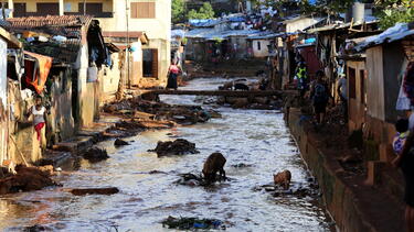 Housing built along the riverbanks in Freetown, Sierra Leone
