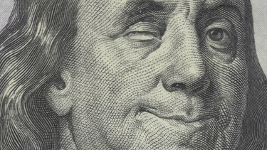 Benjamin Franklin on the $100 bill, winking 