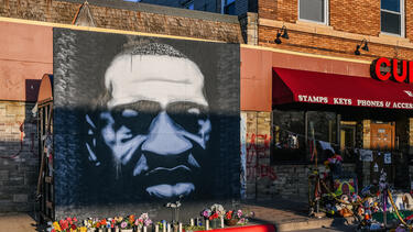 A mural of George Floyd at George Floyd Square in Minneapolis, where Floyd was murdered in June 2020. Photo by Brandon Bell/Getty Images.