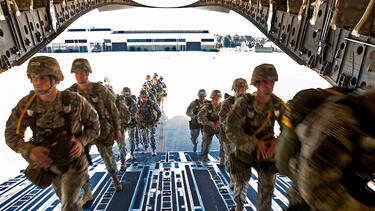 Soldiers boarding a transport plane