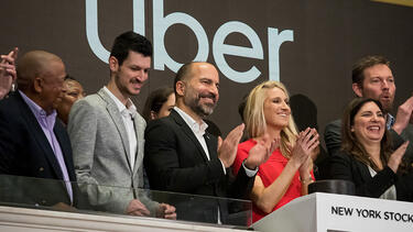 Uber CEO Dara Khosrowshahi, center, at the New York Stock Exchange during the company’s IPO on Friday, May 10. Photo: Michael Nagle/Bloomberg via Getty Images.