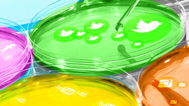 Petri dishes growing icons of popular social media platforms
