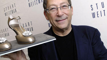 Stuart Weitzman with his diamond-studded “Retro Rose” shoe in 2008. Photo: Toby Canham/Getty Images.