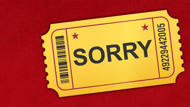 A movie ticket with the word "Sorry" on it