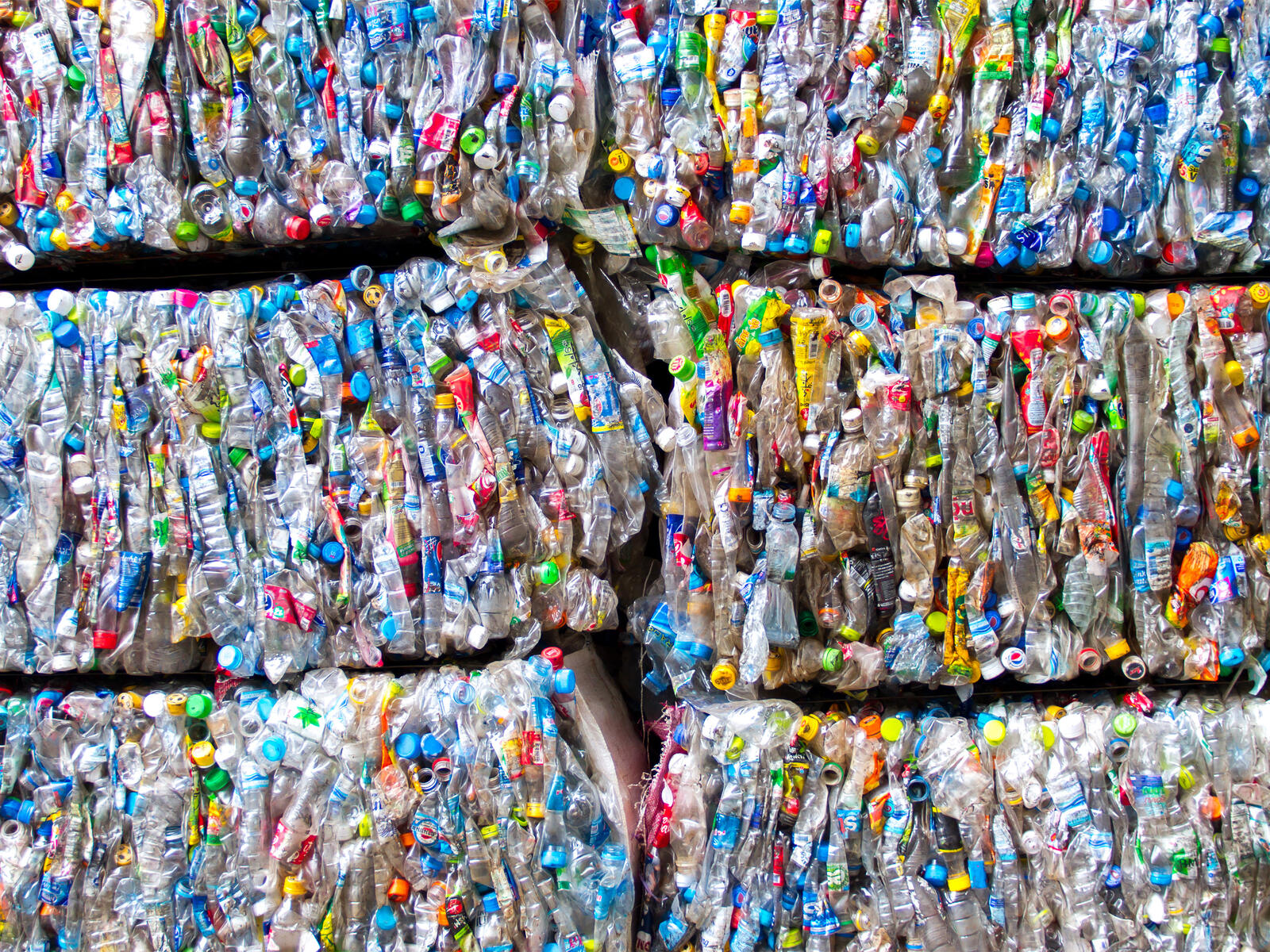 Bundles of crushed plastic containers