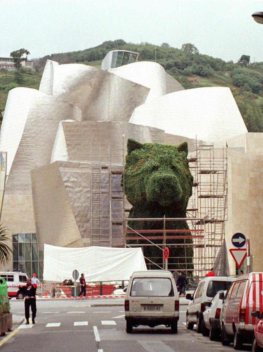 Police outside the Guggenheim Bilbao near Jeff Koons' "Puppy"
