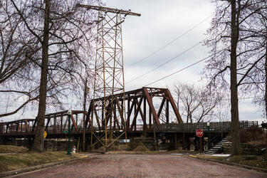 A brick street and railroad bridge crossing the Muskingum River in Marietta, Ohio.