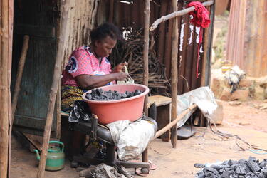Sorting coal for cookstoves, the main source of cooking fuel in Freetown, Sierra Leone
