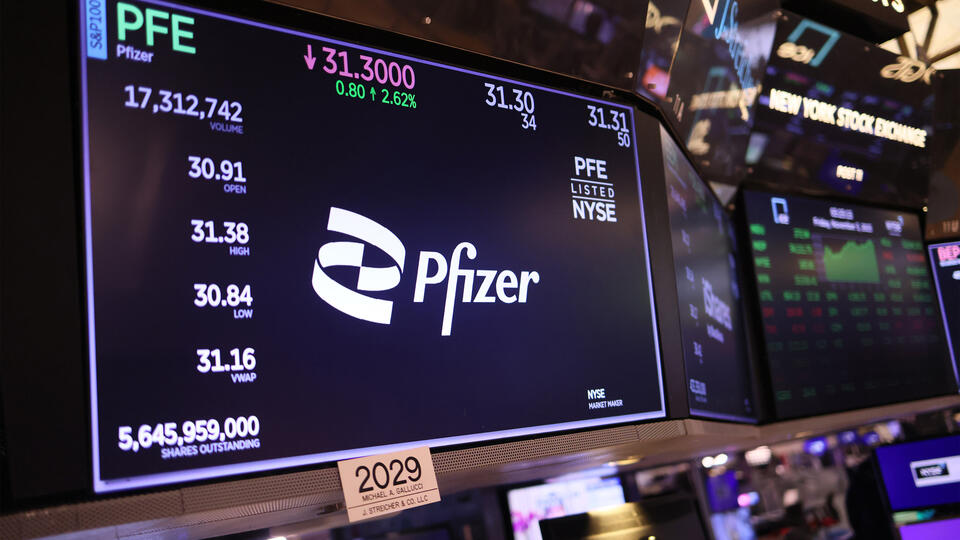 The Pfizer logo and stock price on a display at the New York Stock Exchange