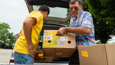 Volunteers making a food delivery.