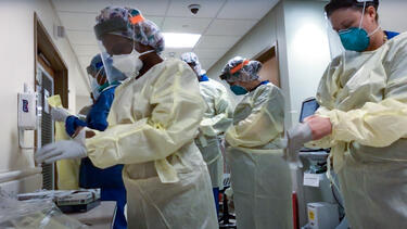 A group of healthcare workers preparing for surgery