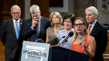 Senator Kyrsten Sinema speaking at a news conference on July 28, 2021. Photo: Stefani Reynolds/Bloomberg via Getty Images.