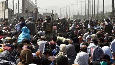 Afghans outside the Kabul airport on August 20, 2021.