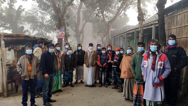 Men in Bangladesh wearing a masks provided as part of a study co-authored by Jason Abaluck.