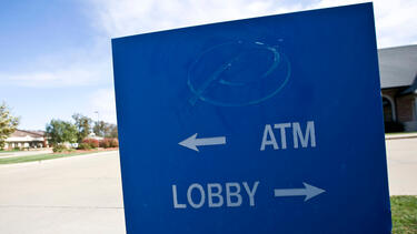 A sign with the logo removed outside a Jefferson, Missouri, branch of Premier Bank, which failed in 2010. 