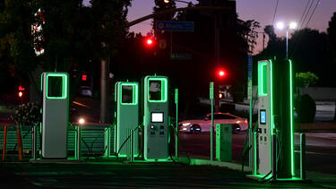 Glowing charging stations at night