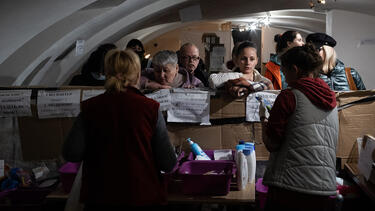 Volunteers with internally displaced people at a humanitarian aid center in Uzhhorod, Ukraine, on March 31, 2022.