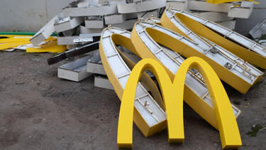 A pile of broken McDonald's signs