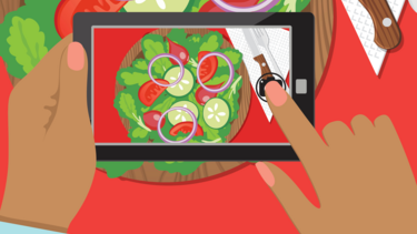 An illustration of a smartphone taking a photo of a salad