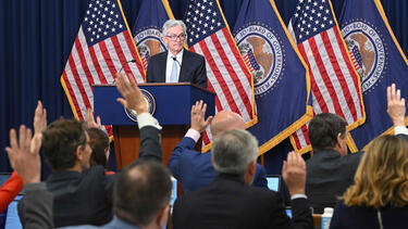 Federal Reserve Board chairman Jerome Powell answering questions at a news conference.