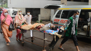 A COVID-19 patient is taken to a hospital in Dhaka, Bangladesh, in July 2021.