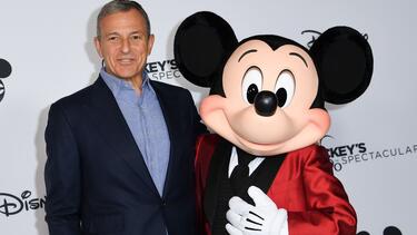Robert Iger with Mickey Mouse at an event