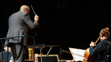 A conductor with an orchestra