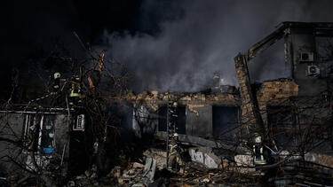 Emergency services workers at the site of a drone attack in February in Odesa, Ukraine. 