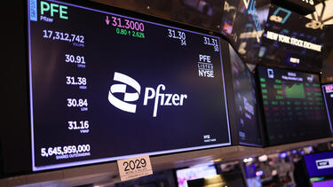 The Pfizer logo and stock price on a display at the New York Stock Exchange