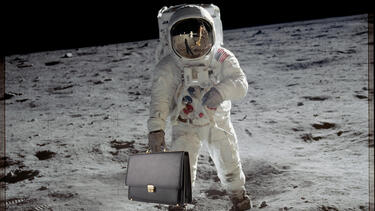 A photo illustration of an astronaut on the moon holding a briefcase