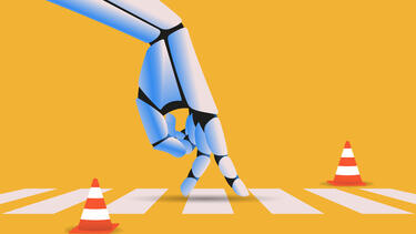 A robot hand walking across a crosswalk surrounded by traffic cones