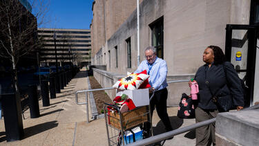 A federal worker who lost her job leaves the Department of Health and Human Services on April 1.