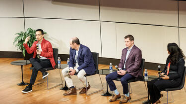 Speakers on stage at the Responsible AI in Global Business Conference 
