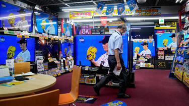 Baseball playing on TVs in an electronics store in Japan