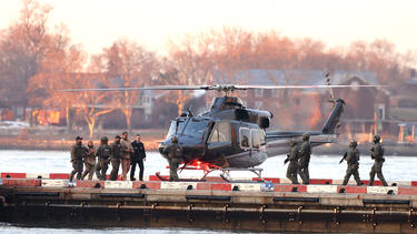 Nicolas Maduro and his wife Cilia Flores being taken off a helicopter