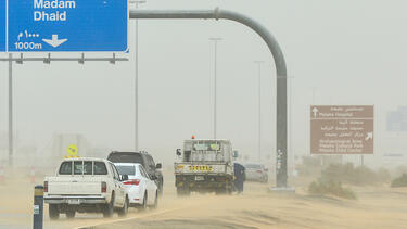 Haboob in Dubai seen on the highway with cars