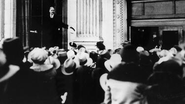 John Poole, president of the Federal American Bank, reassuring a crowd of anxious depositors in February 1931. Photo: Popperfoto via Getty Images.