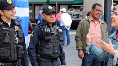 Police officers talking with citizens in Mexico