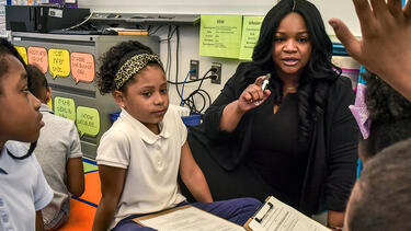 Third-grade students with their teacher in a Washington, D.C., classroom. Photo: Bill O’Leary/The Washington Post via Getty Images.