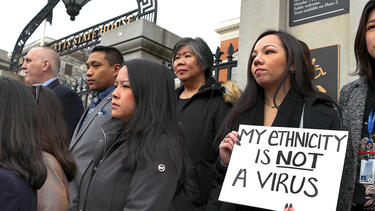 Members of the Asian American Commission hold a press conference.