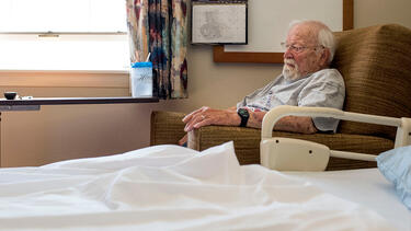 An elderly man in a nursing home