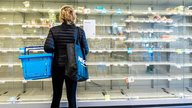 A shopper confronting empty shelves at a grocery store in Wassenaar, The Netherlands, on March 14, 2020. Photo: Michel Porro/Getty Images.