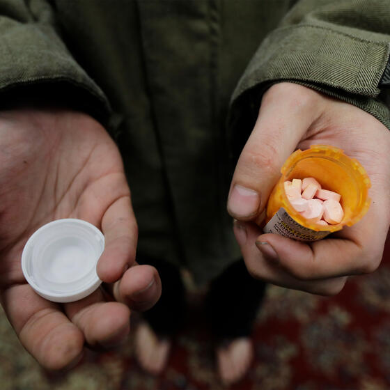 A patient with a bottle of buprenorphine outside a clinic in Olympia, Washington, in November 2019. AP Photo/Ted S. Warren.