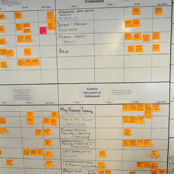 A scrum board covered with sticky notes at Ariadne Labs.
