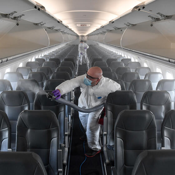 A contractor disinfecting a Frontier airplane at Denver International Airport in May 2020. Photo: AAron Ontiveroz/MediaNews Group/The Denver Post via Getty Images.