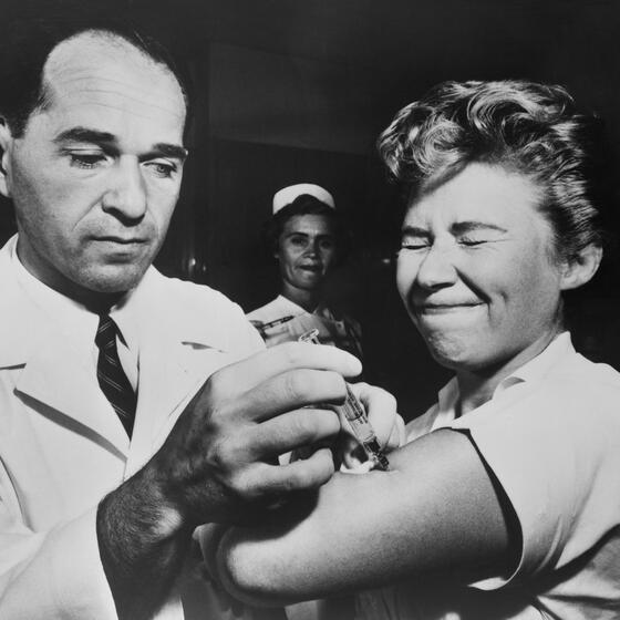 A nurse at Montefiore Hospital in New York City receives a flu vaccination in 1957. Photo: Everett Collection Historical/Alamy Stock Photo.