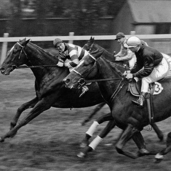 A vintage photo of a horse race