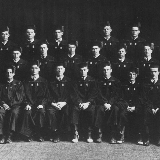 A group portrait of students from 1930 in academic robes