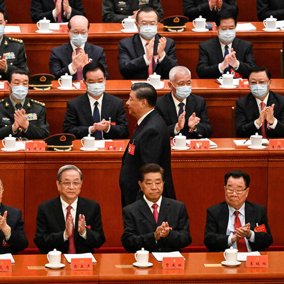 President Xi Jinping walking through a row of Chinese Communist Party officials.